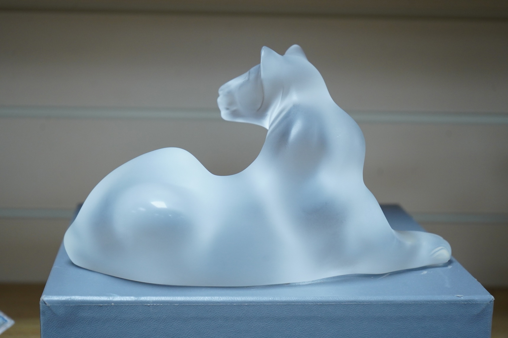 A Lalique glass figure, ‘Simba Lioness’, signed to the base, boxed, 24cm wide